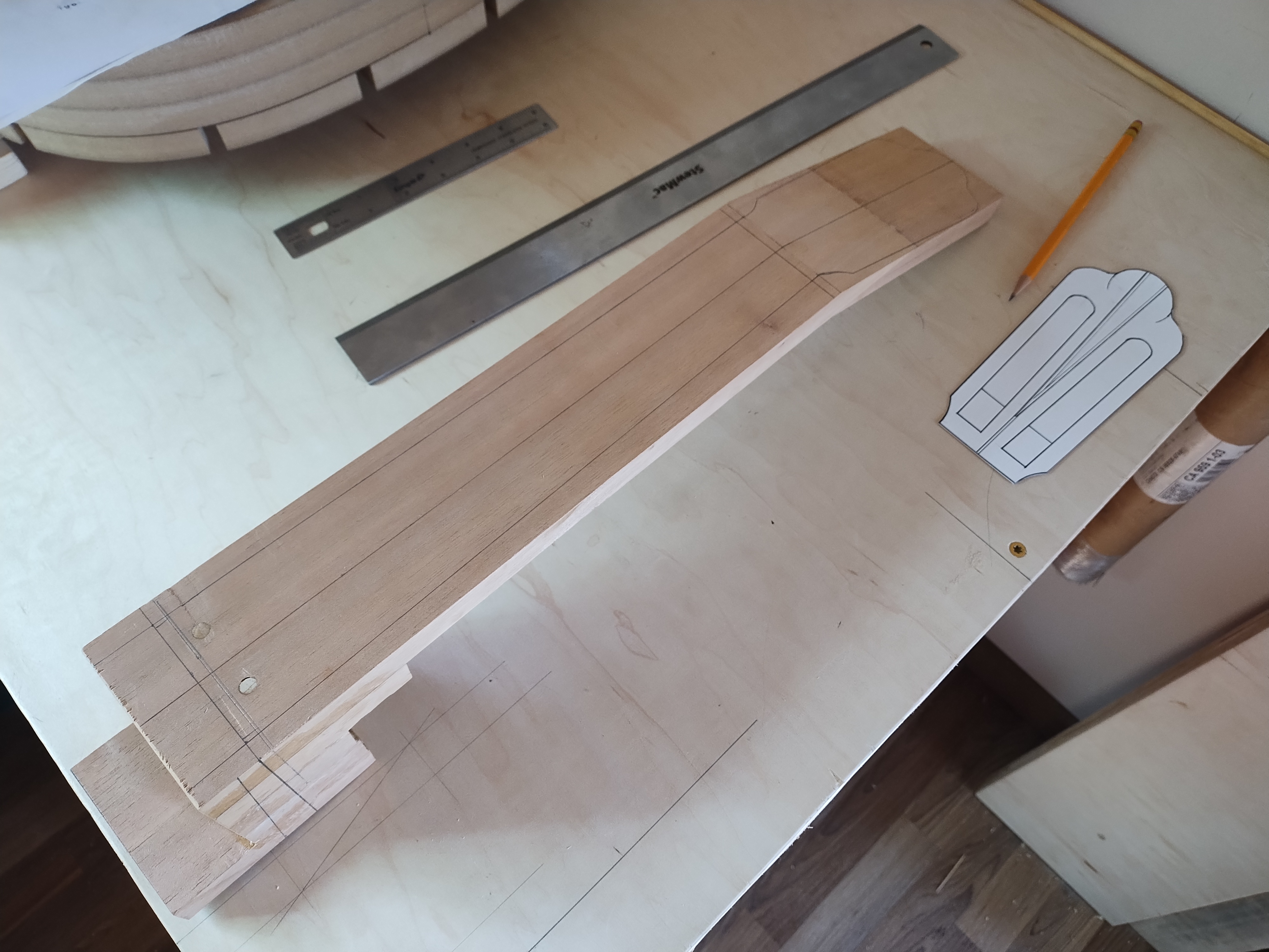 Hand carving the neck of a custom classical guitar